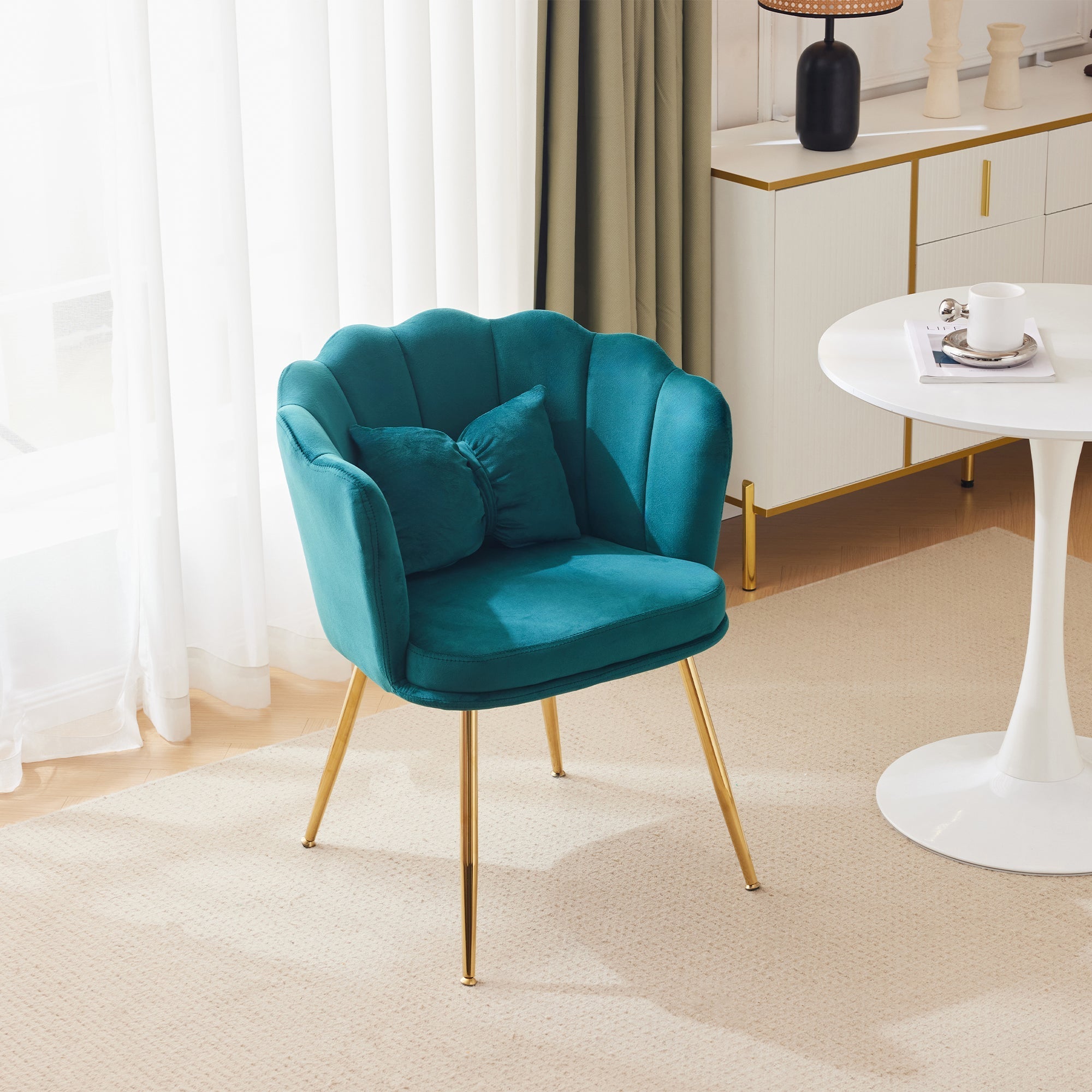 Modern velvet armchair, comfortable upholstered with petal back, gold-plated metal legs and butterfly cushion