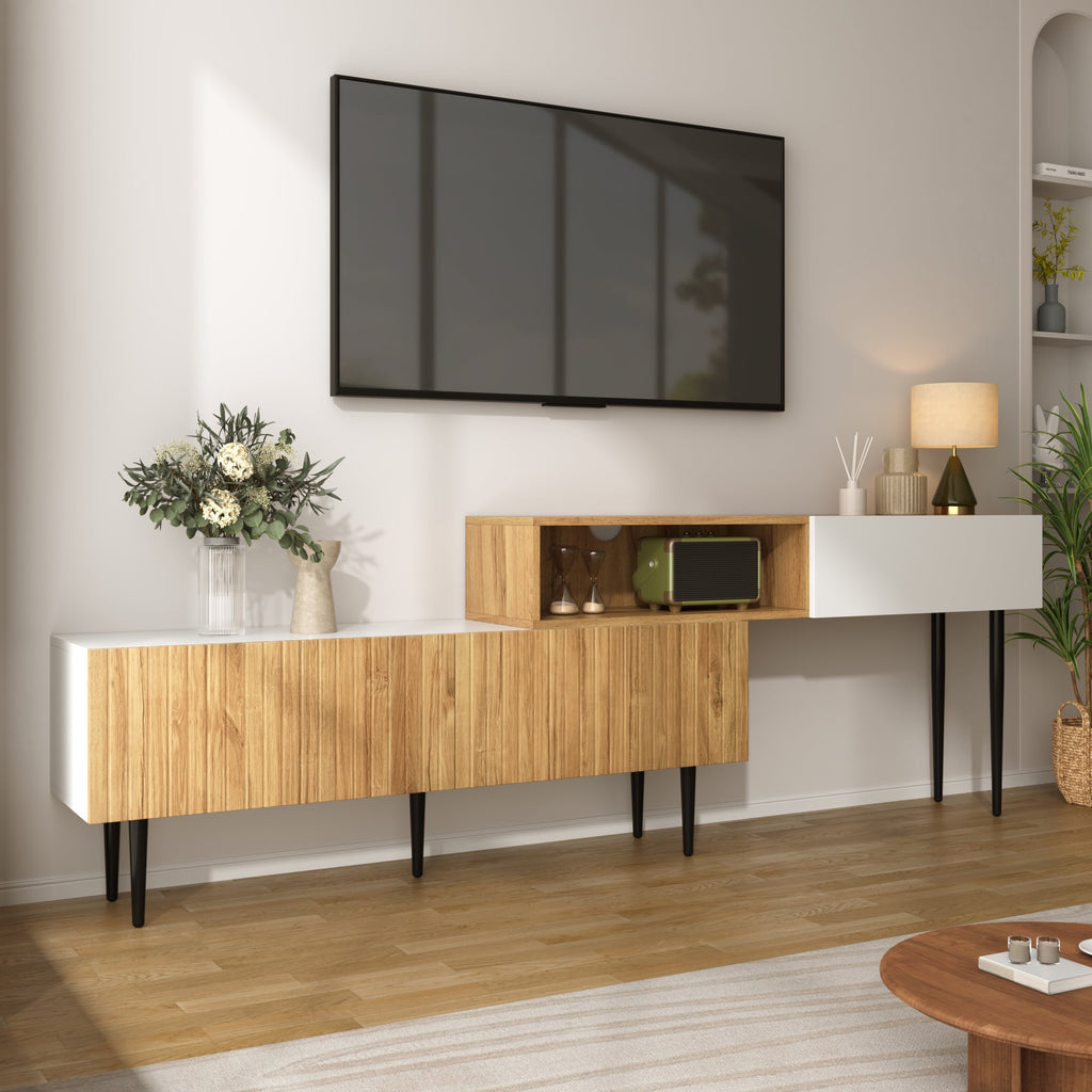 Modern living room with wooden and white entertainment console, TV, and decor items.