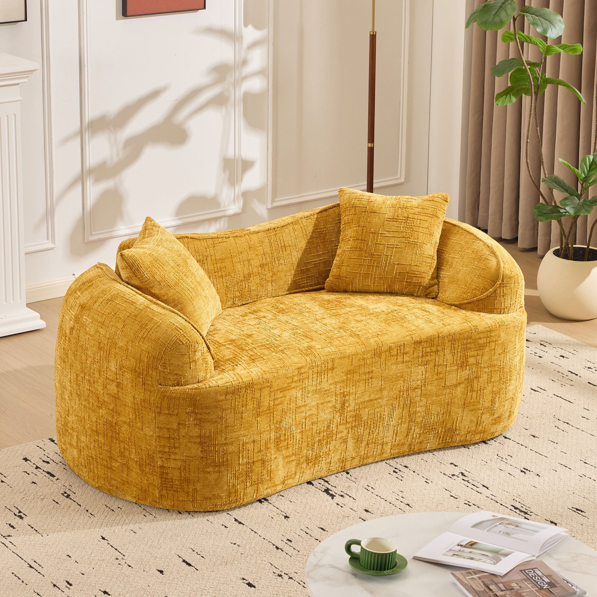 Yellow curved two-seater sofa with armrests and 2 cushions, cream-colored