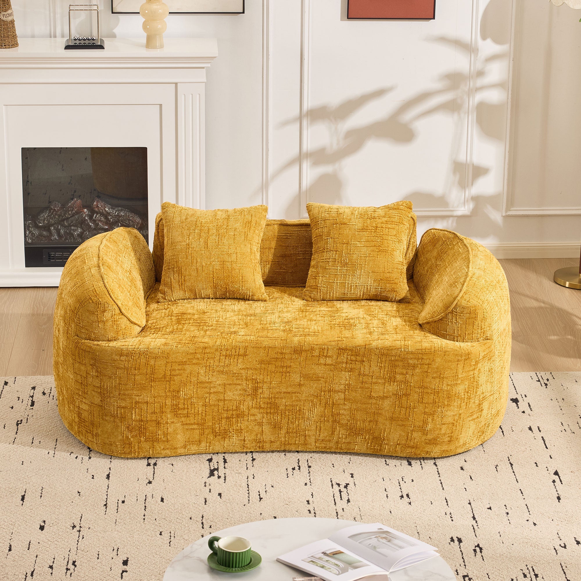 Yellow curved two-seater sofa with armrests and 2 cushions, cream-colored