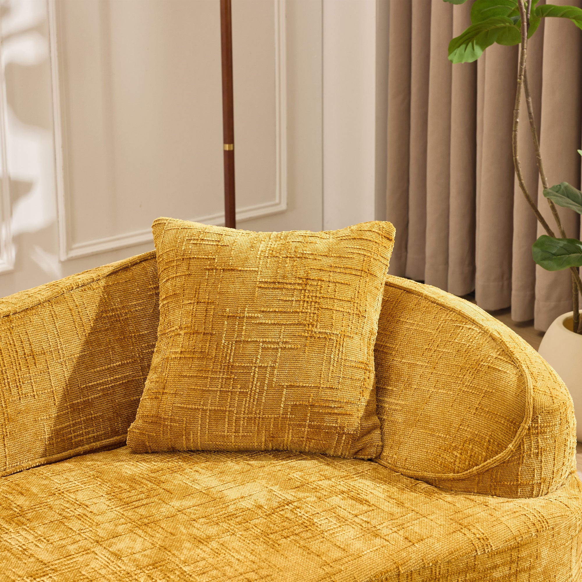 Yellow curved two-seater sofa with armrests and 2 cushions, cream-colored