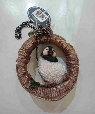 VA Hanging Penguin on Birch Log